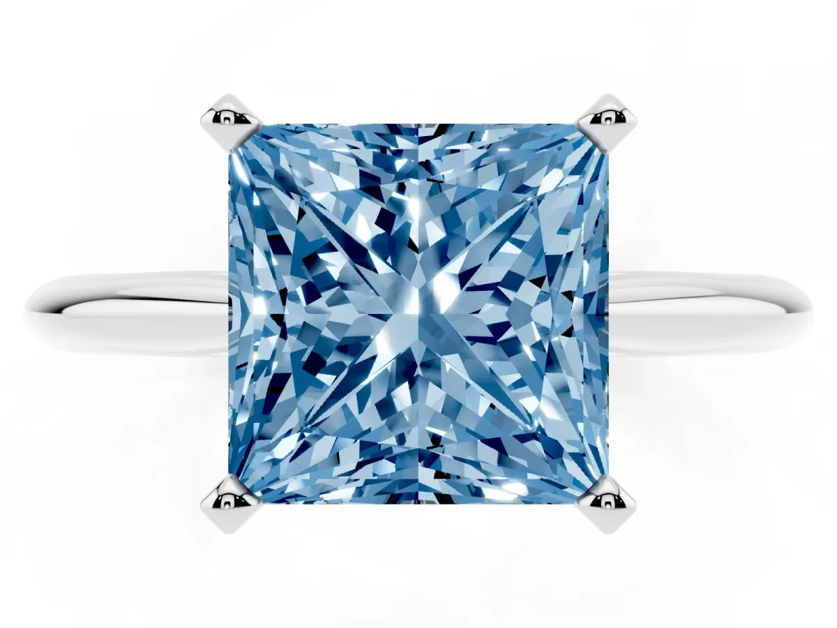 Fancy Blue Princess Cut Cut Solitaire Ring with Four-Prong Setting on a Classic Band Silver