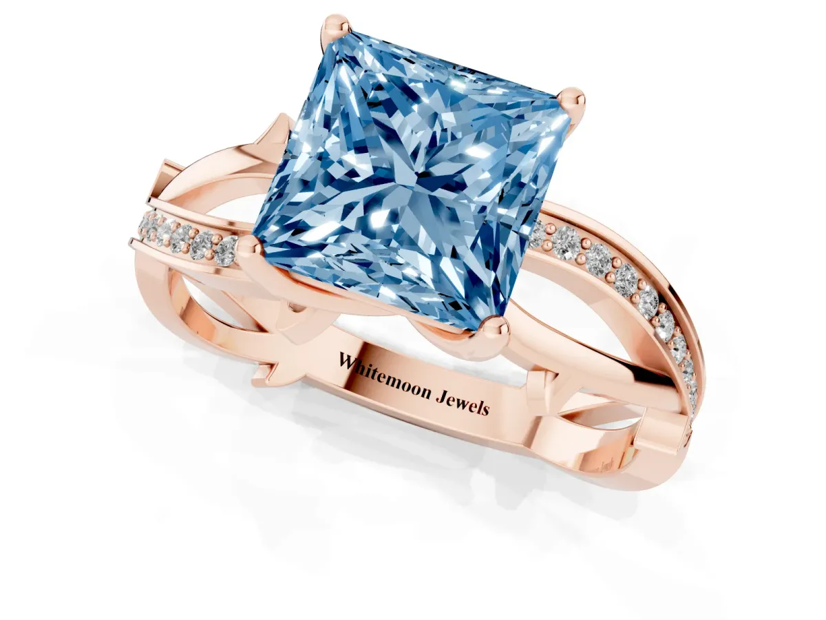Fancy Blue Princess Cut Solitaire Twist Band with Pavé Accents and Four-Prong Setting Rose gold