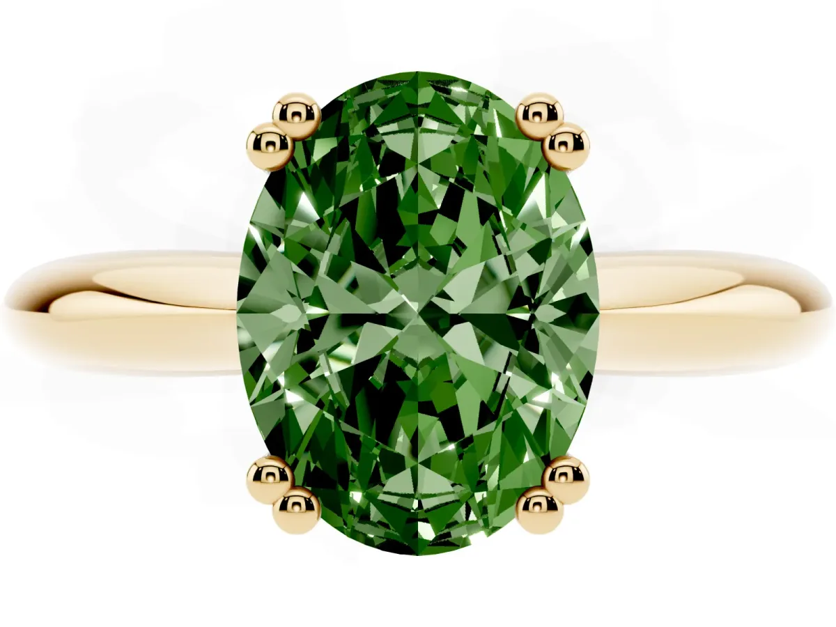 Fancy Green Oval Cut Cut Solitaire Engagement Ring with Tapered Band and Four-Prong Setting Yellow gold