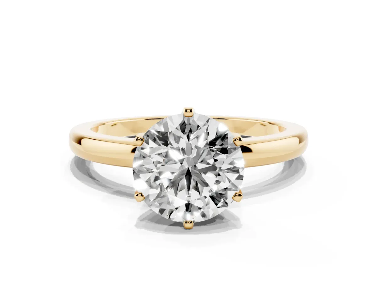 Round Cut Solitaire Diamond Ring with Six-Prong Setting on a Classic Band Yellow gold