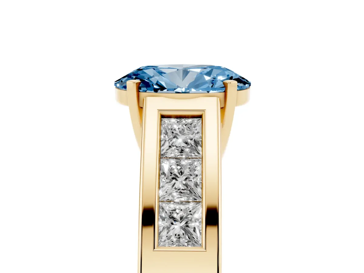 Fancy Blue Oval Cut Cut Channel Set Solitaire Ring with Four-Prong Setting Yellow gold