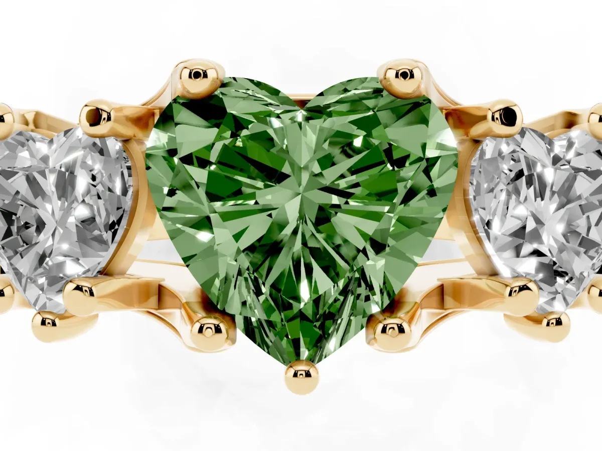Fancy Green Heart Cut Diamond Three-Stone Ring with Channel Set Band and Four-Prong Setting Yellow gold