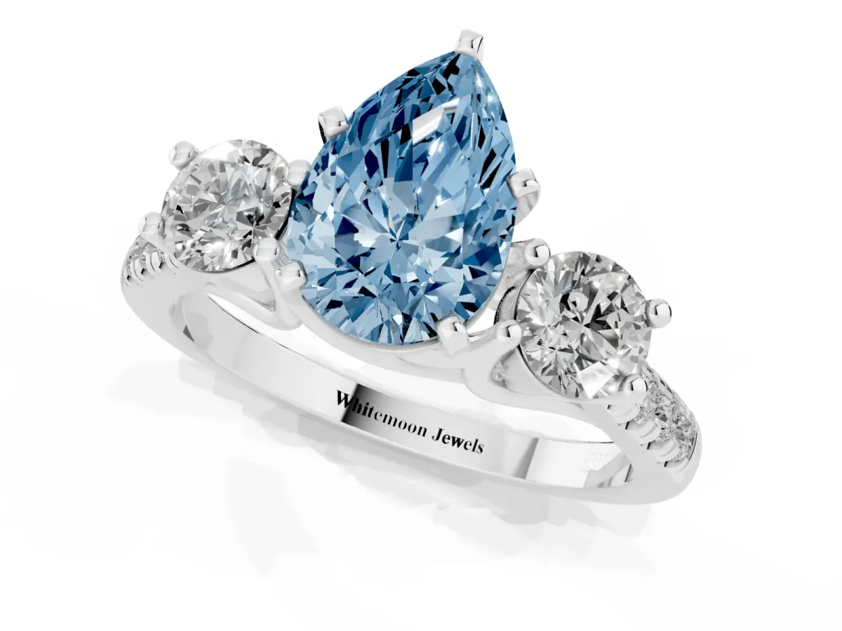 Fancy Blue Three-Stone Pear Cut Diamond Pavé Band with Four-Prong Setting Platinum