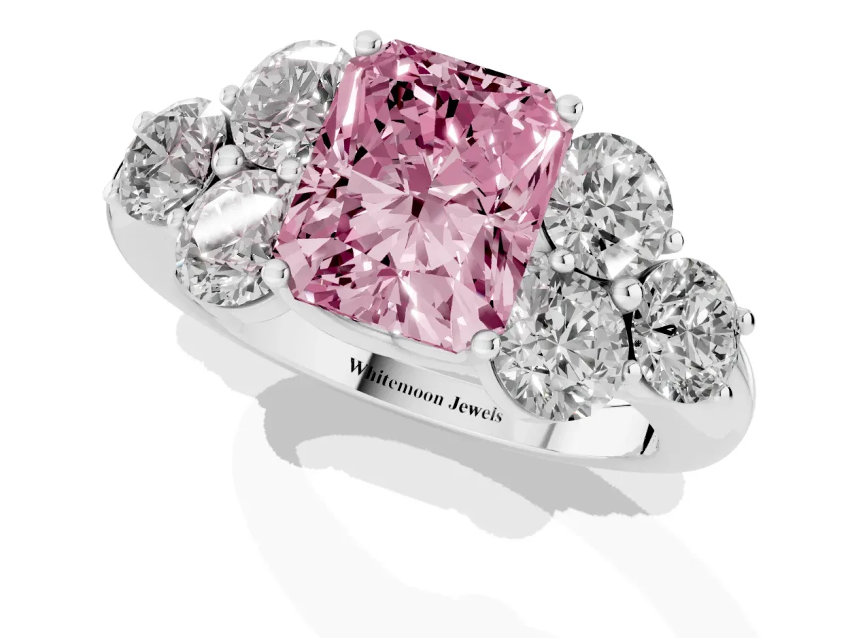 Fancy Pink Radiant Cut Cut Diamond Cluster Ring with Round Accent Stones and Prong Setting on a Classic Band White gold
