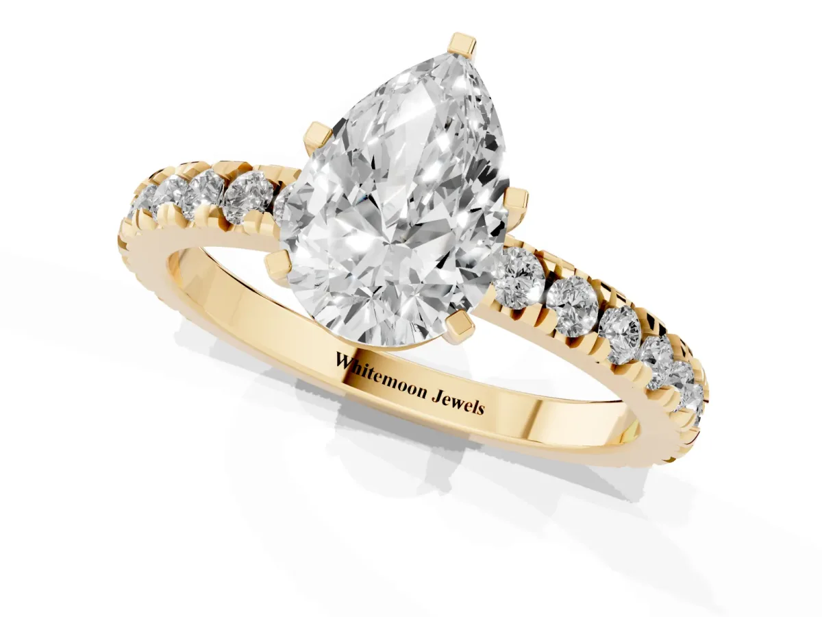 Pear Cut Diamond Pavé Band Solitaire with Four-Prong Setting Yellow gold