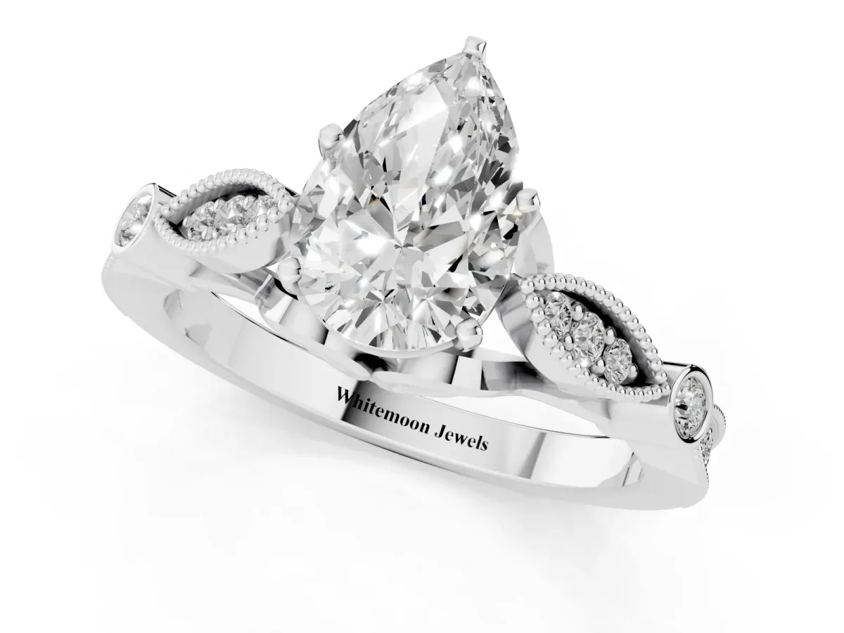 Pear Cut Cut Diamond with Milgrain Marquise and Bezel Accents on a Solitaire Band with Prong Setting Platinum