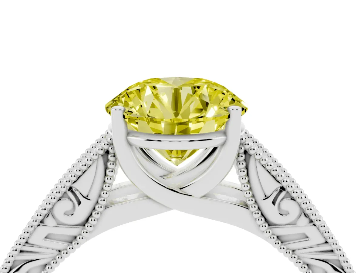 Fancy Yellow Round Cut Diamond Solitaire Ring with Engraved Band and Four-Prong Setting White gold