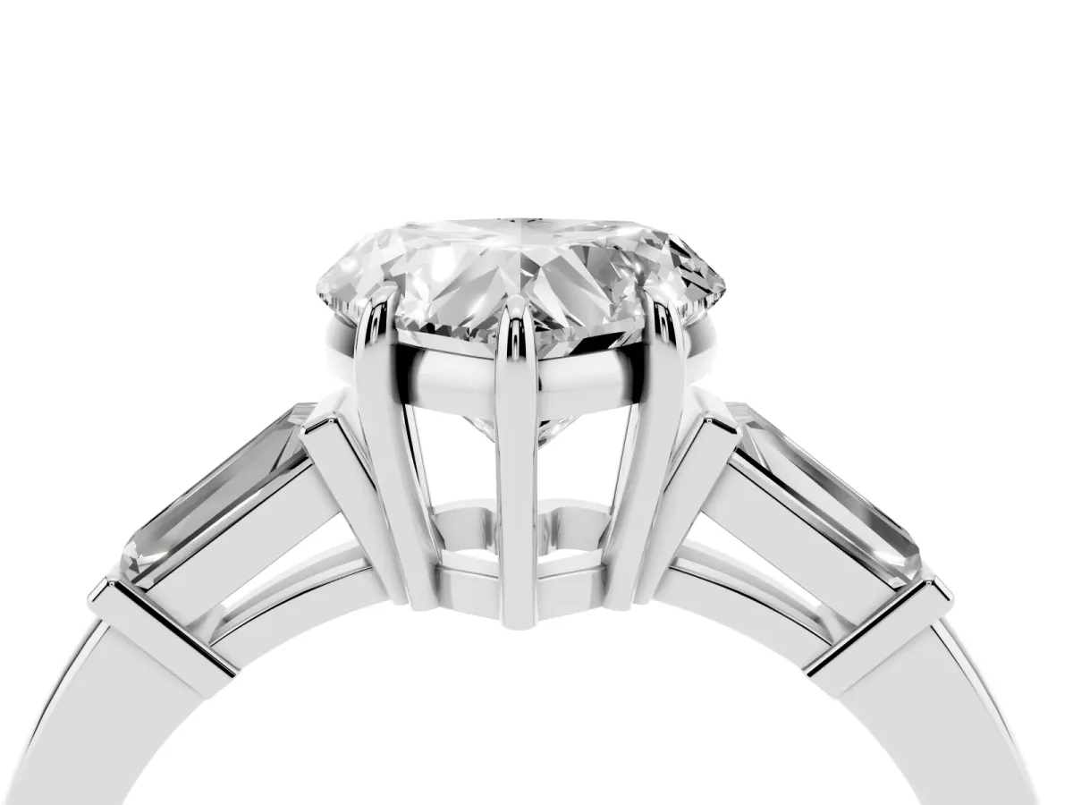 Heart Cut Diamond Three-Stone Ring with Tapered Baguette Side Stones and Prong Setting Platinum