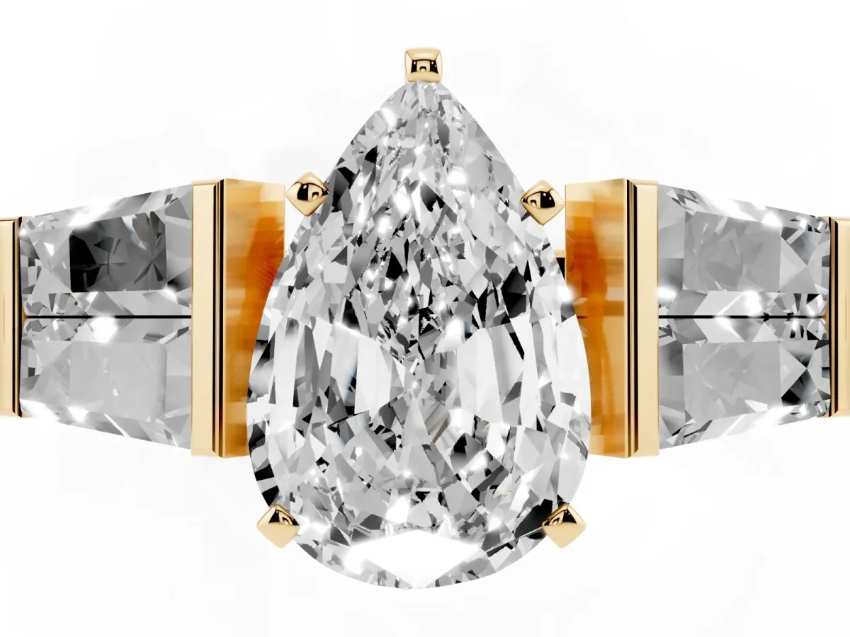 Pear Cut Diamond Engagement Ring with Baguette Side Stones and Channel Set Band Yellow gold