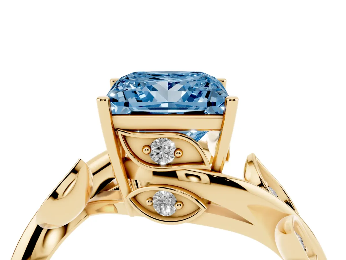 Fancy Blue Princess Cut Solitaire Twist Engagement Ring with Leaf Accents and Prong Setting Yellow gold