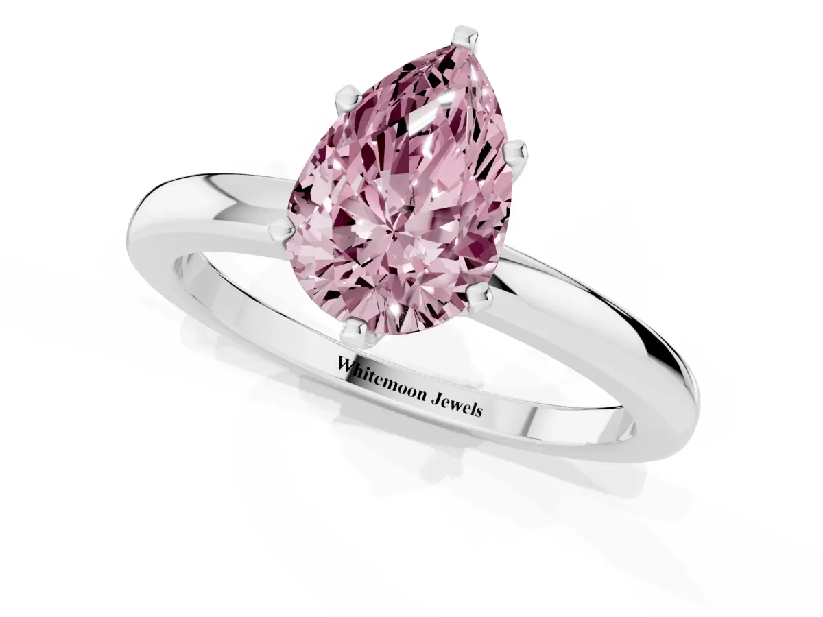 Fancy Pink Pear Cut Solitaire Diamond Ring with Six-Prong Setting on a Classic Band Silver