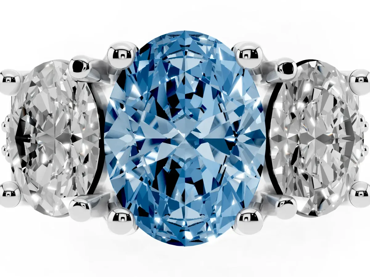 Fancy Blue Oval Cut Diamond Three-Stone Ring with Channel Set Band and Four-Prong Setting Silver
