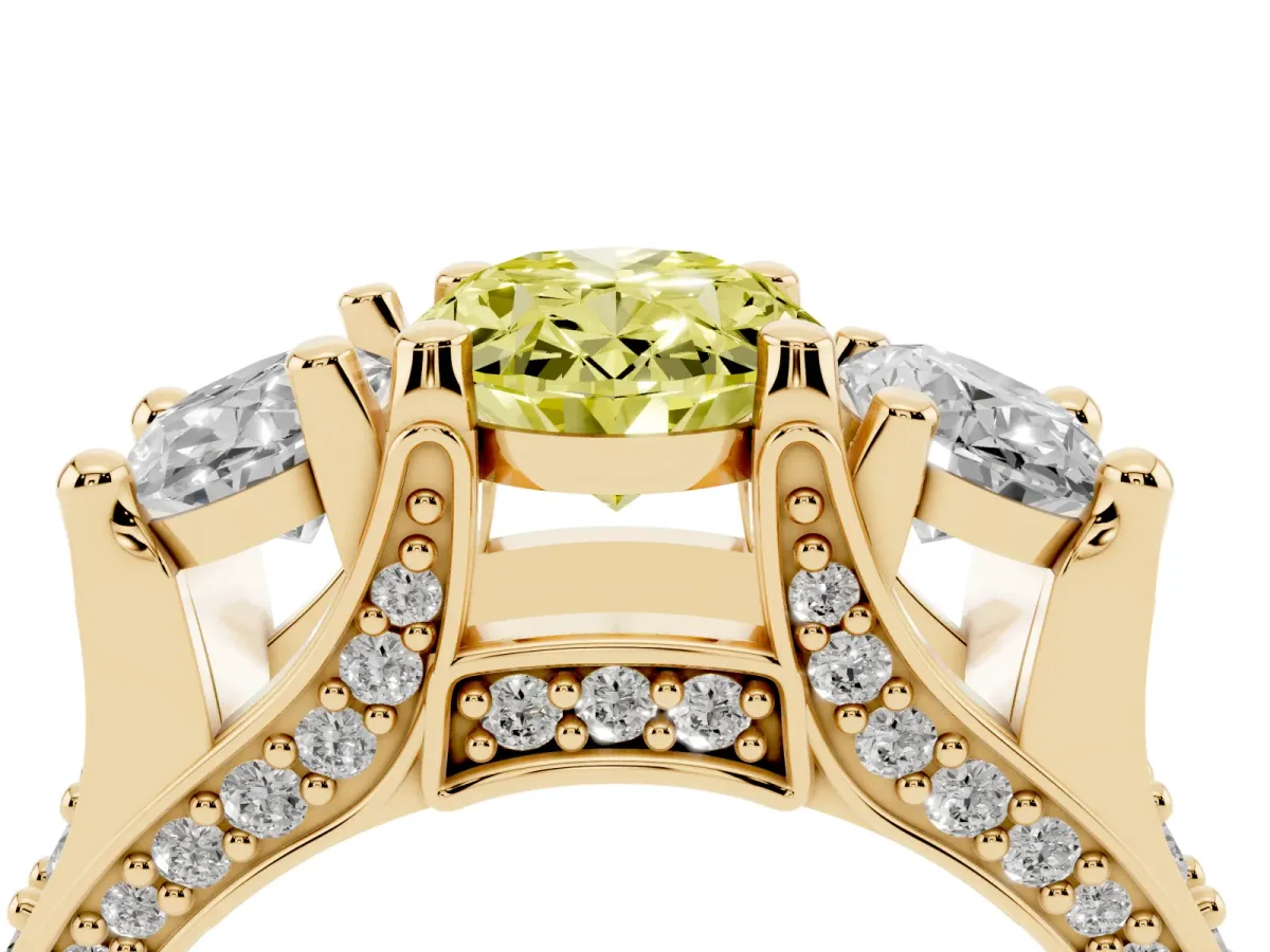 Fancy Yellow Oval Cut Diamond Three-Stone Ring with Channel Set Band and Four-Prong Setting Yellow gold