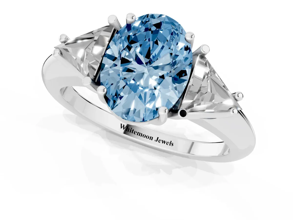 Fancy Blue Three-Stone Oval Cut Diamond Engagement Ring with Trillion Side Stones and Prong Setting Silver
