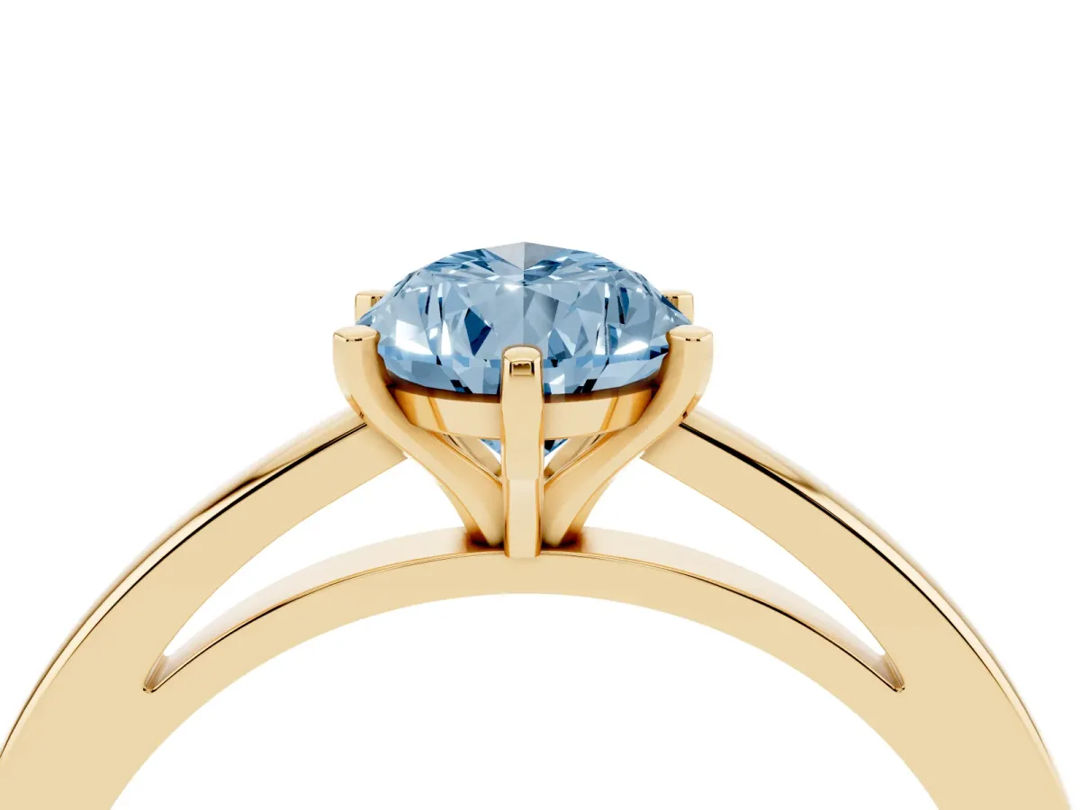 Fancy Blue Pear Cut Solitaire Diamond Engagement Ring with Four-Prong Setting on a Classic Band Yellow gold