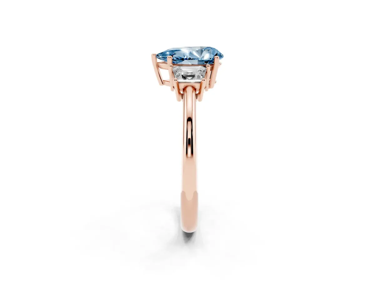 Fancy Blue Pear Cut Diamond Three-Stone Ring with Trapezoid Side Stones and Prong Setting Rose gold
