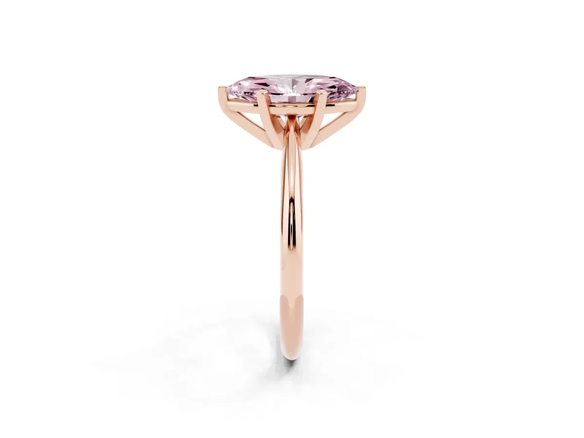 Fancy Pink Marquise Cut Cut Solitaire Ring with Four-Prong Setting on a Classic Band Rose gold