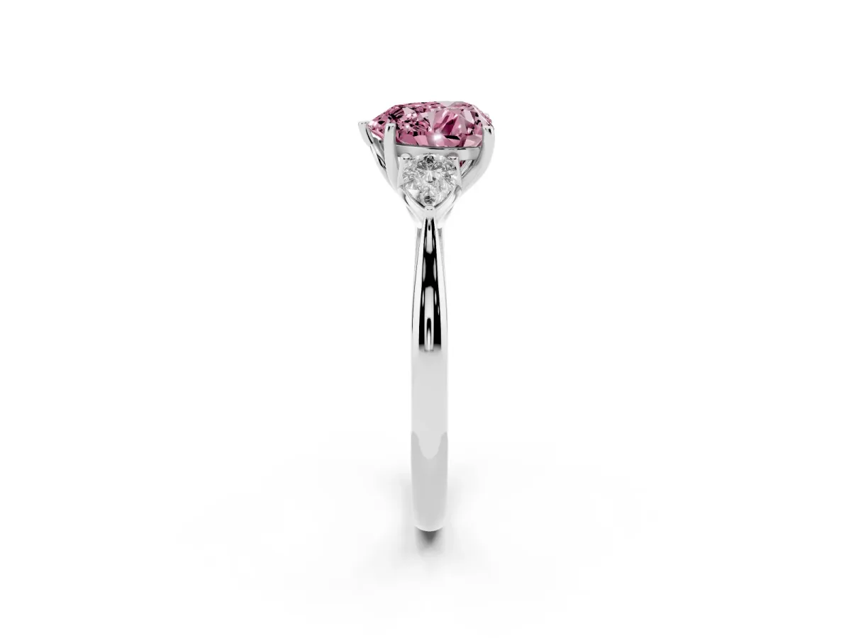 Fancy Pink Three-Stone Heart Cut Brilliant Diamond Solitaire Ring with Tapered Band and Four-Prong Setting White gold
