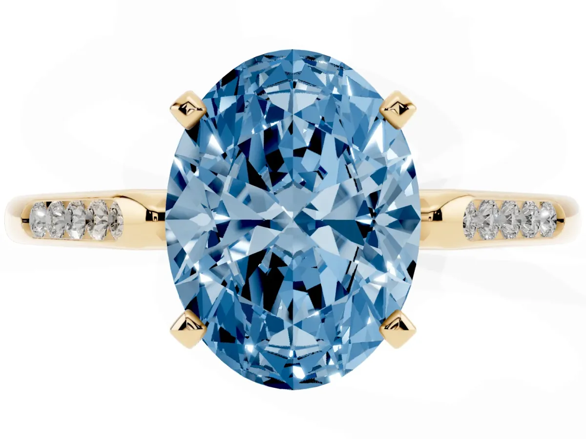 Fancy Blue Oval Cut Diamond Solitaire Ring with Channel Set Round Band and Prong Setting Yellow gold