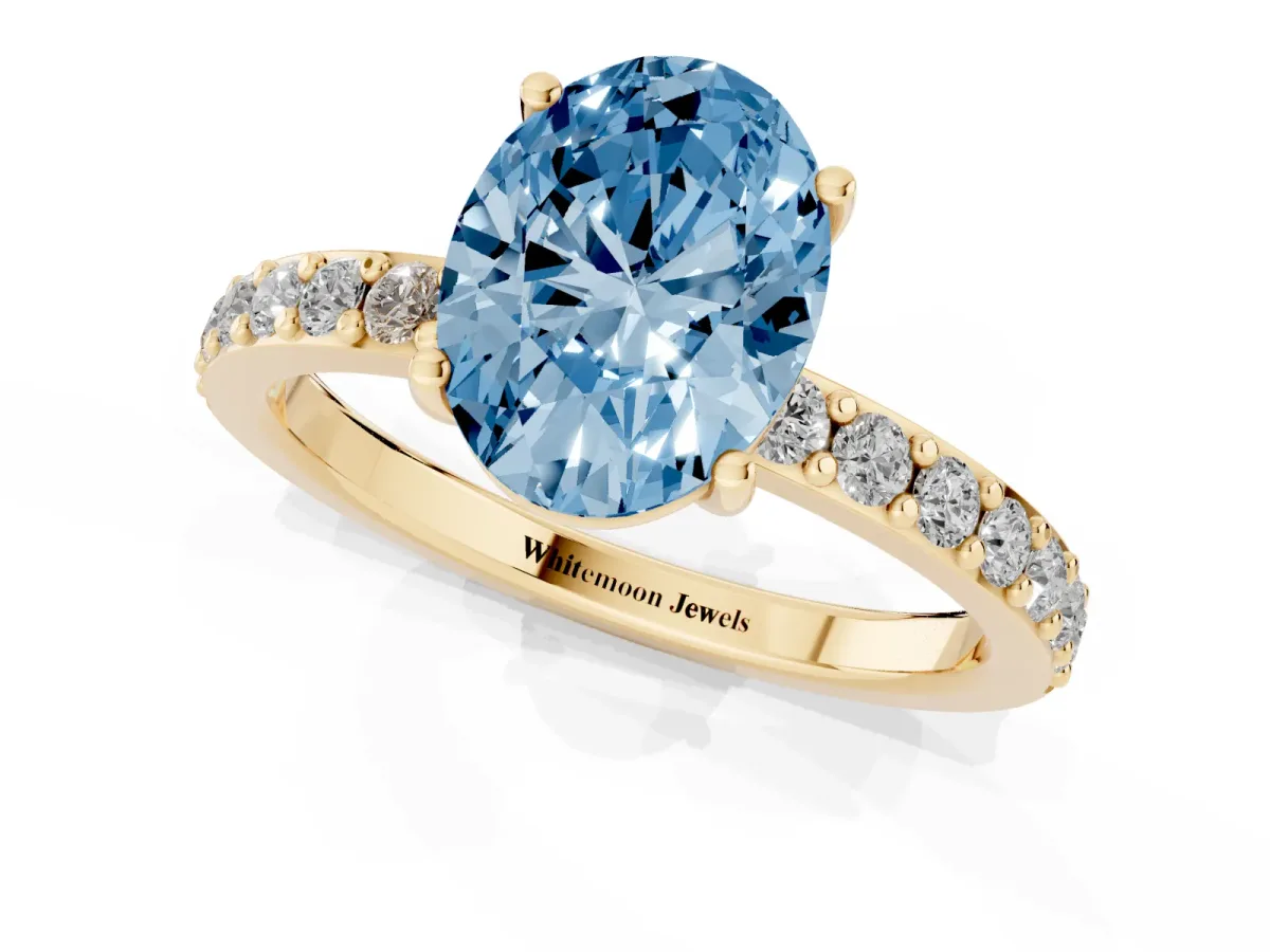 Fancy Blue Oval Cut Cut Diamond Solitaire with Pave Band and Four-Prong Setting Yellow gold