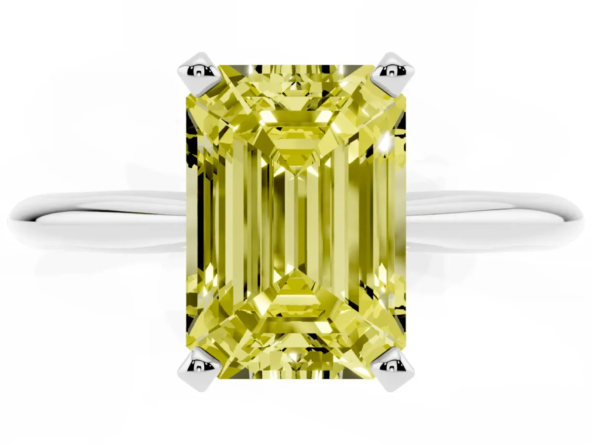 Fancy Yellow Emerald Cut Cut Solitaire Ring with Four-Prong Setting on a Classic Band Silver