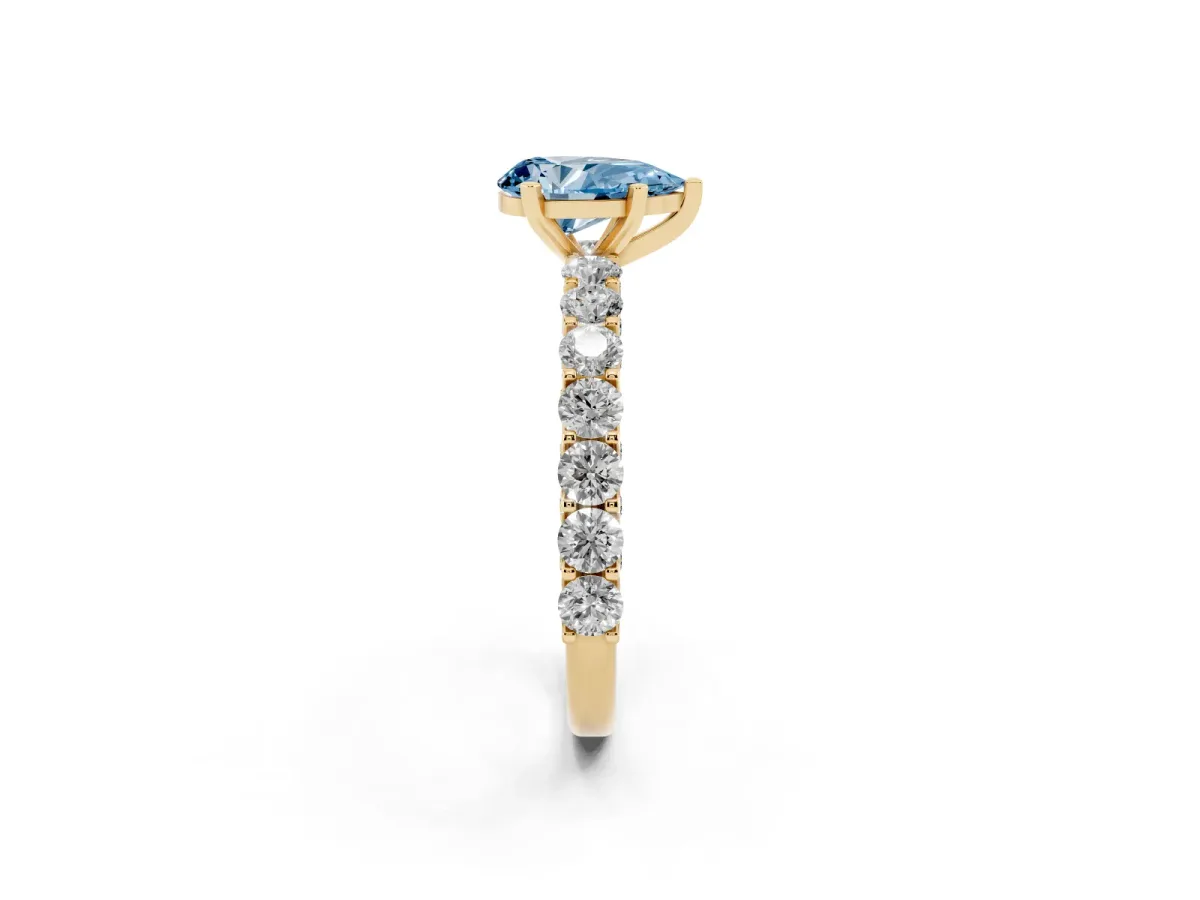 Fancy Blue Pear Cut Diamond Solitaire Ring with Shared Prong Pavé Band and Four-Prong Setting Yellow gold