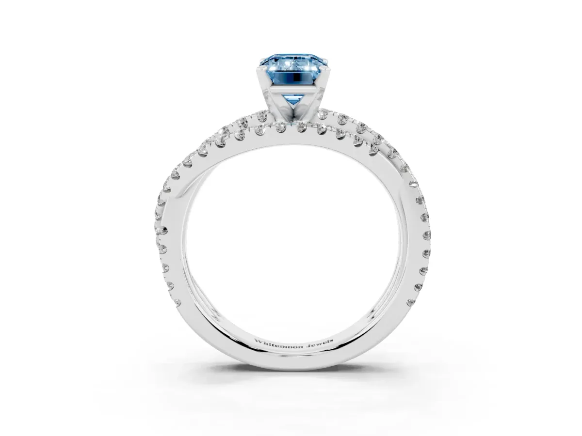 Fancy Blue Emerald Cut Solitaire Twist Band with Pavé Setting and Four-Prong Setting Silver