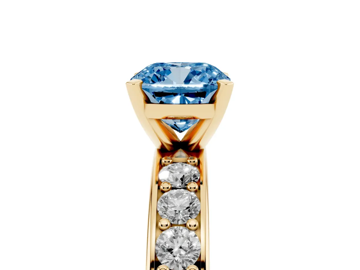 Fancy Blue Cushion Cut Diamond Engagement Ring with Channel Set Round Band and Prong Setting Yellow gold