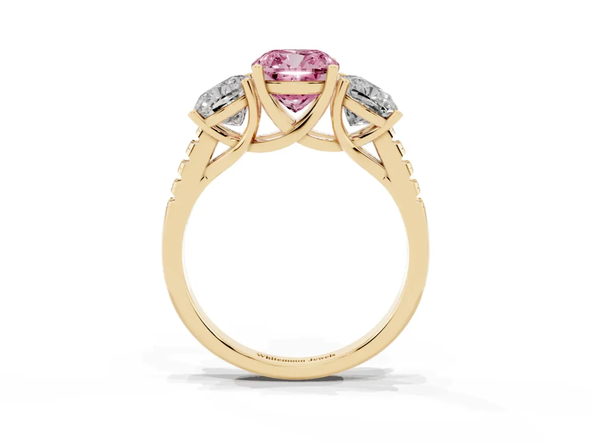 Fancy Pink Three-Stone Cushion Cut Diamond Ring with Round Pavé Band and Prong Setting Yellow gold