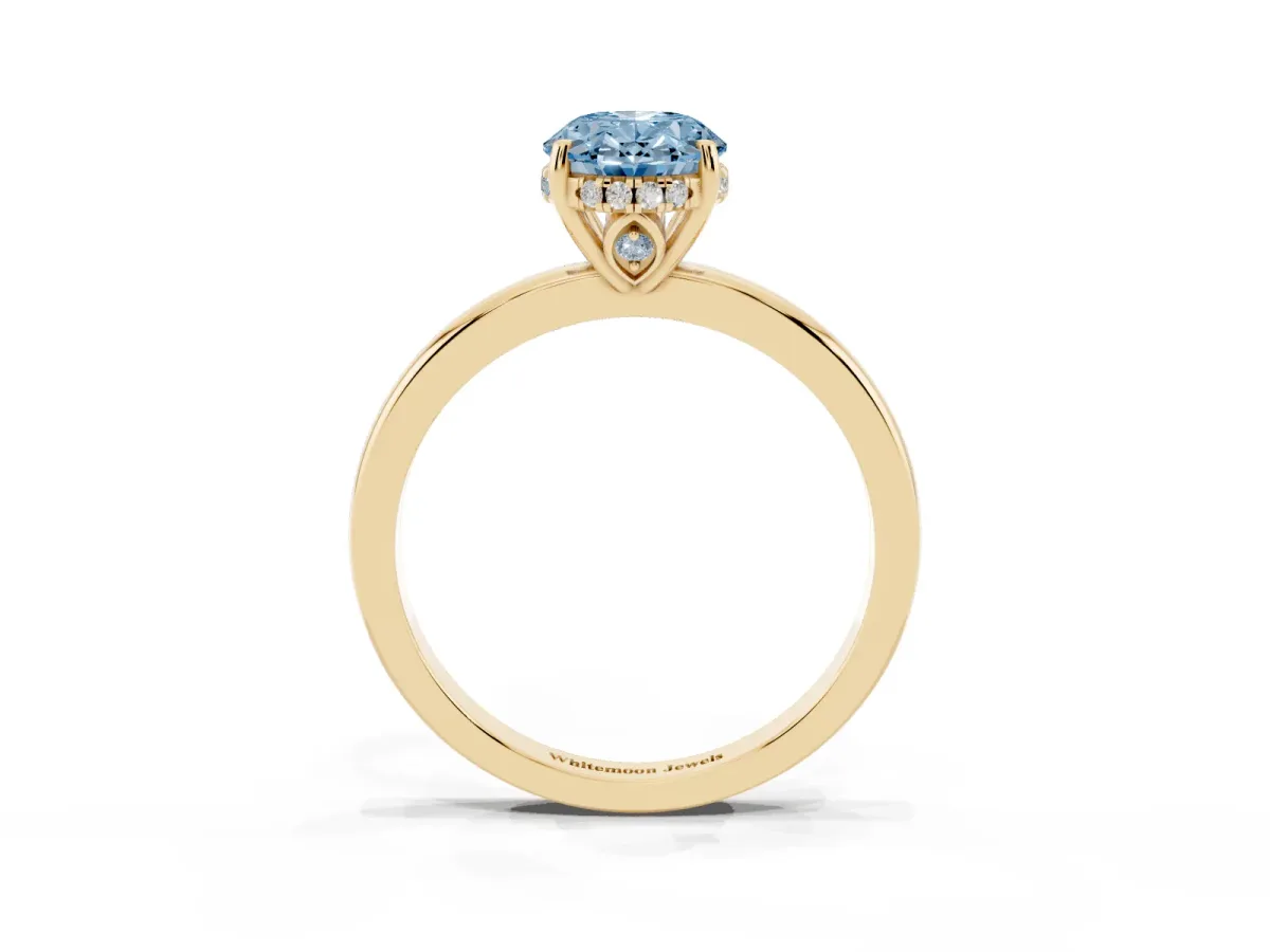 Fancy Blue Oval Cut Solitaire Diamond Ring with Prong Setting and Plain Band Yellow gold