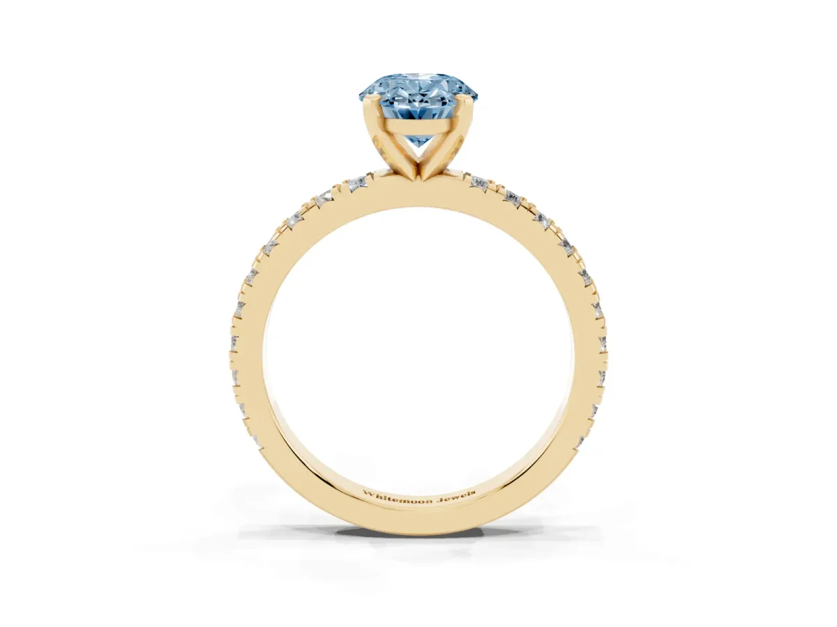 Fancy Blue Oval Cut Diamond Pavé Band Solitaire with Four-Prong Setting Yellow gold