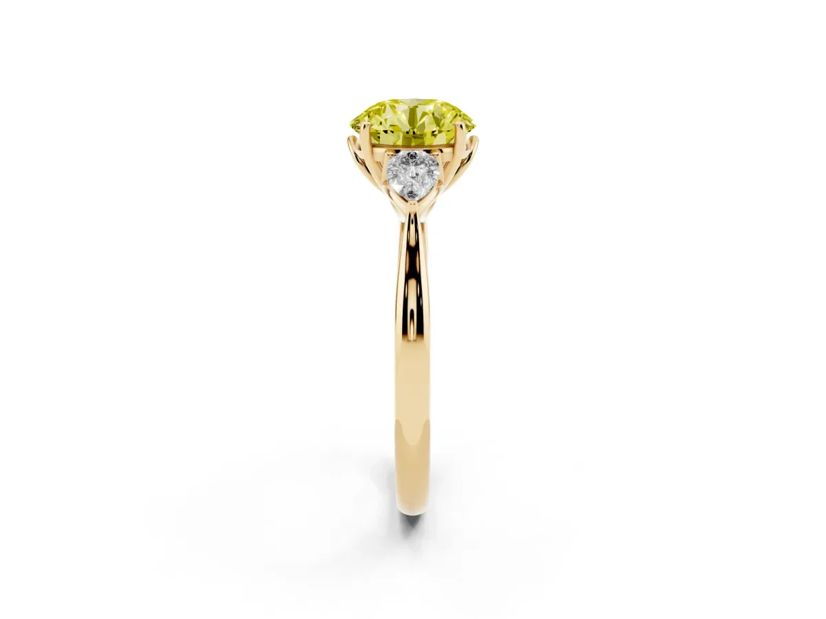Fancy Yellow Three-Stone Round Cut Diamond Ring with Pear Side Stones in Four-Prong Setting Yellow gold