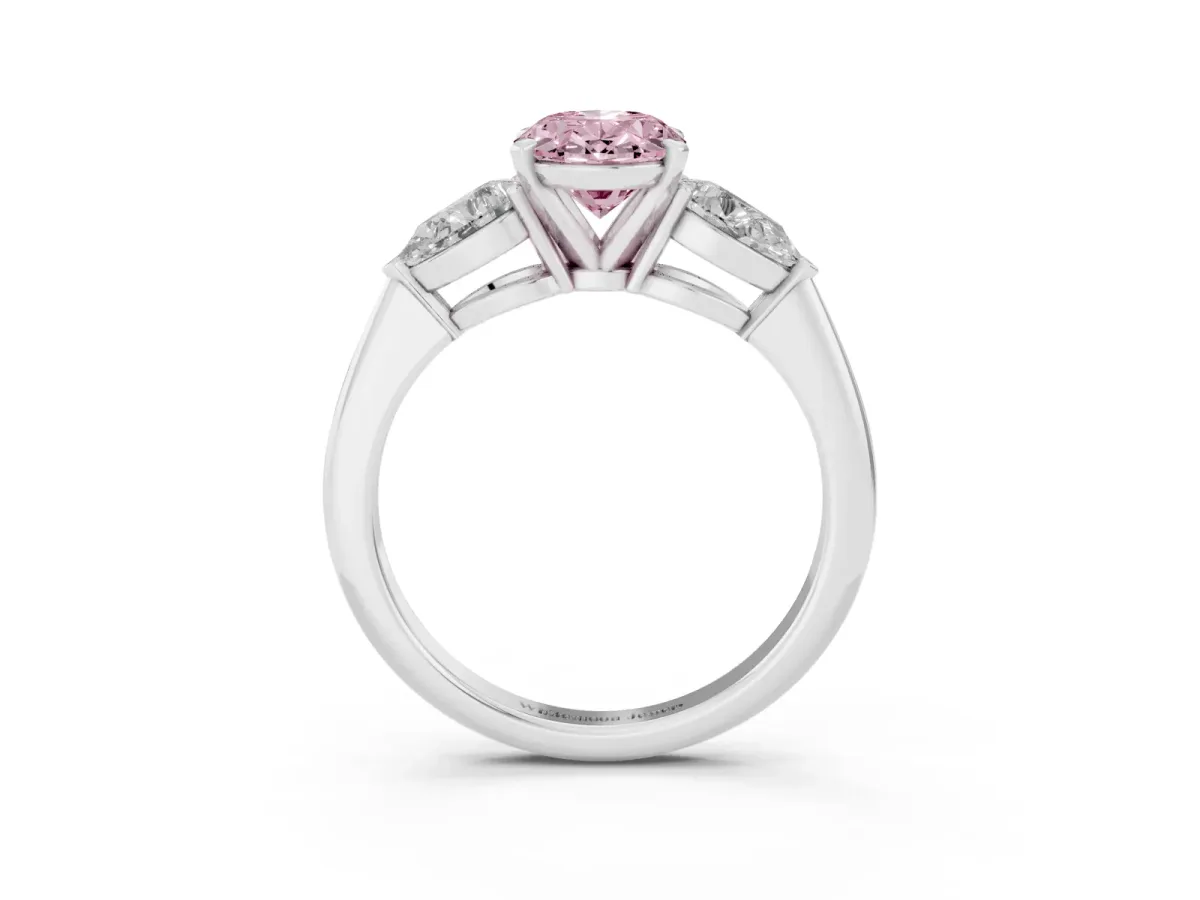Fancy Pink Three-Stone Oval Cut Diamond Ring with Pear Side Stones and Four-Prong Setting Silver