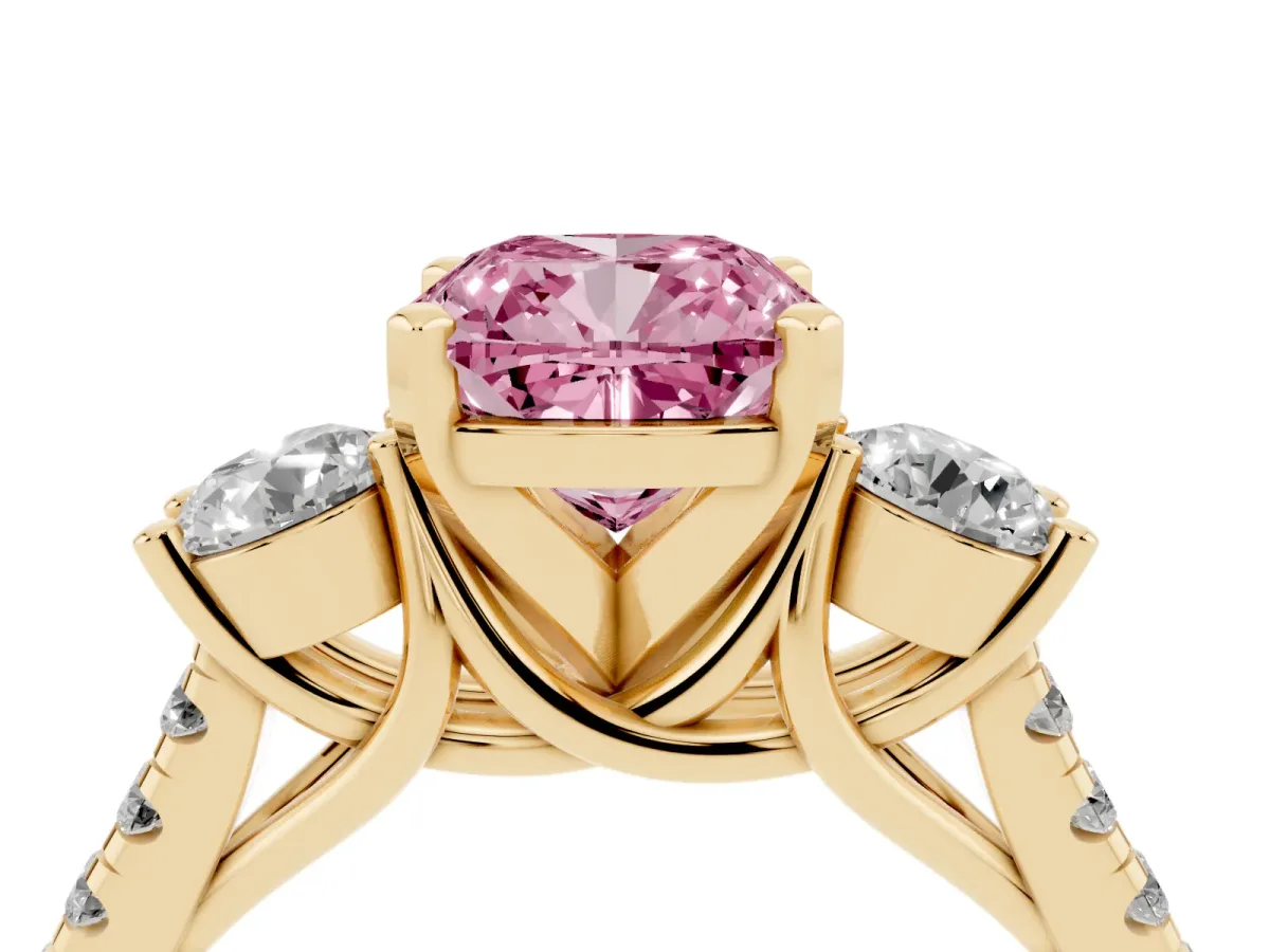 Fancy Pink Three-Stone Cushion Cut Diamond Pavé Band with Four-Prong Setting Yellow gold