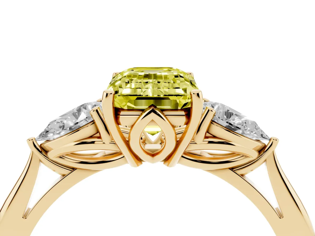 Fancy Yellow Three-Stone Emerald Cut Diamond Ring with Pear Side Stones in Four-Prong Setting Yellow gold