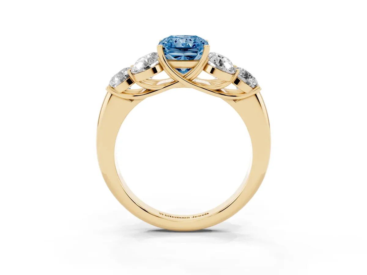 Fancy Blue Radiant Cut Cut Diamond Cluster Ring with Round Accent Stones and Prong Setting on a Classic Band Yellow gold