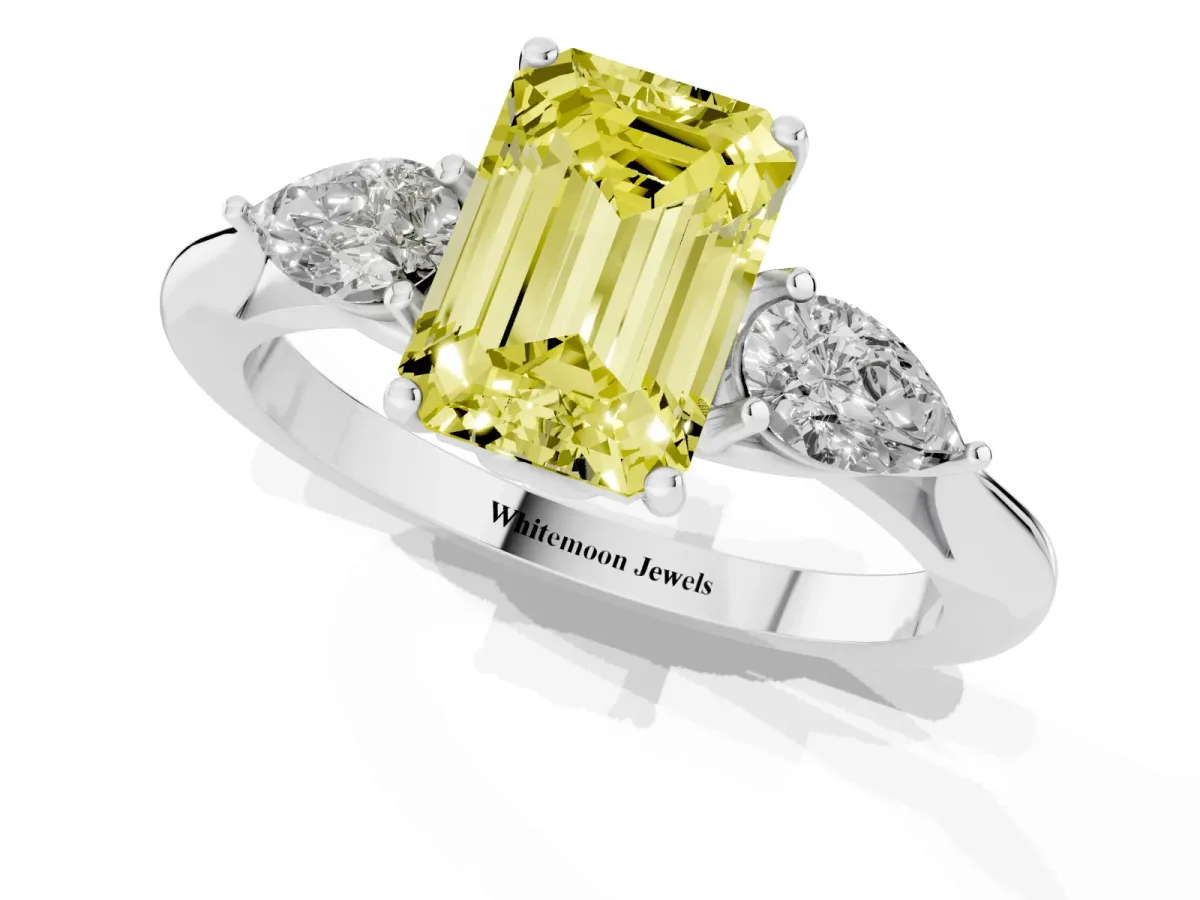 Fancy Yellow Three-Stone Emerald Cut Diamond Ring with Pear Side Stones in Four-Prong Setting Silver