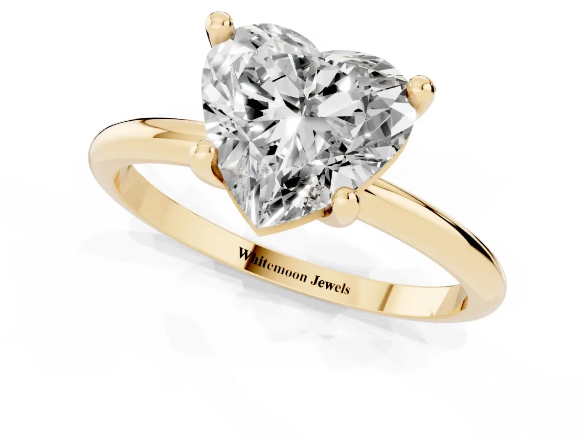 Heart Cut Solitaire Diamond Ring with 4-Prong Setting on a Classic Band Yellow gold