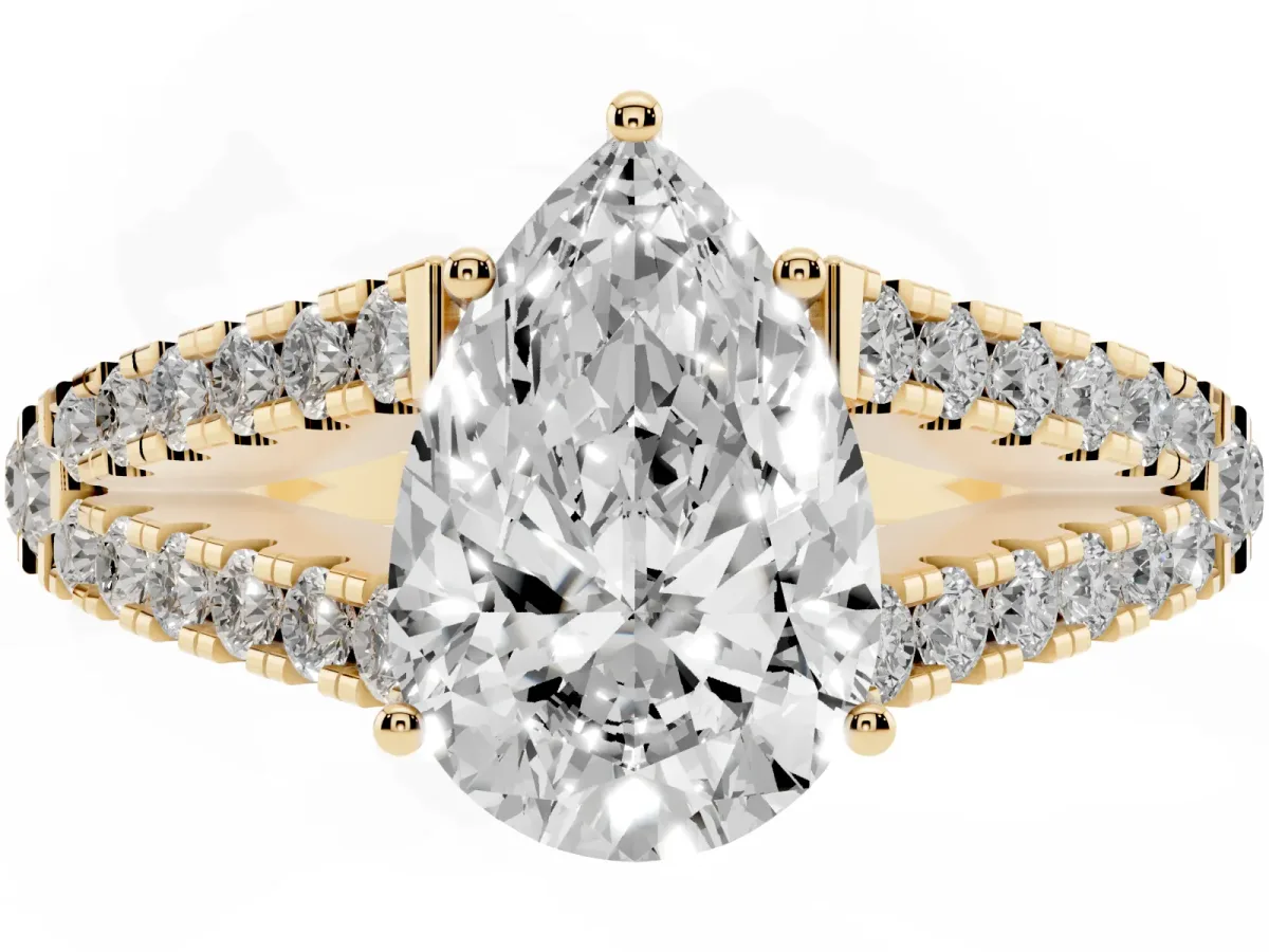 Pear Cut Diamond Split Shank Engagement Ring with Round Pavé and Prong Setting Yellow gold
