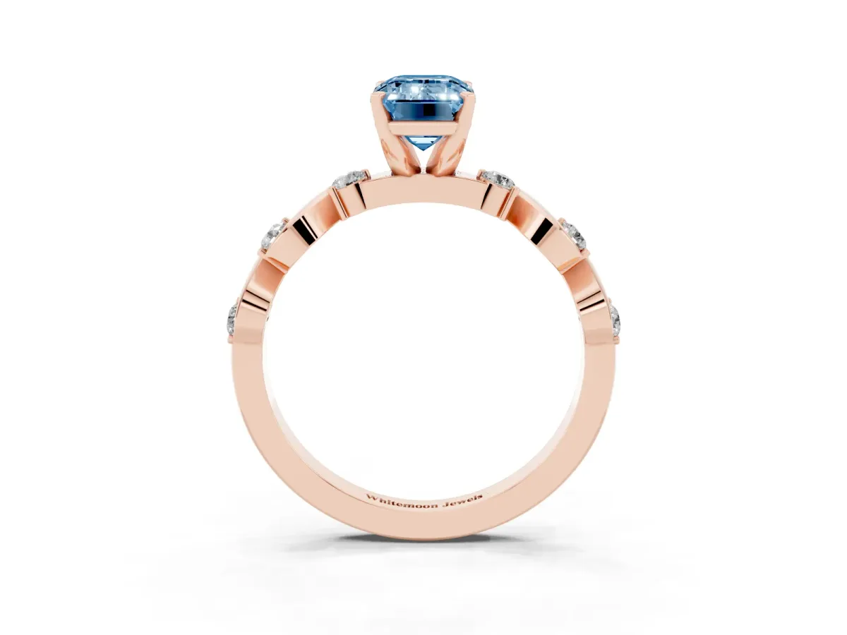Fancy Blue Emerald Cut Diamond Solitaire Twisted Band with Round Accents and Prong Setting Rose gold