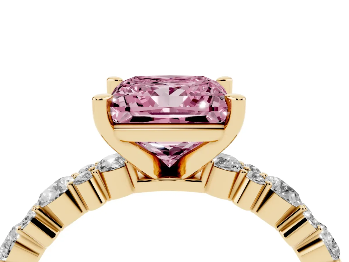 Fancy Pink Princess Cut Diamond Side Stone Solitaire Ring with Round and Four-Prong Setting Yellow gold