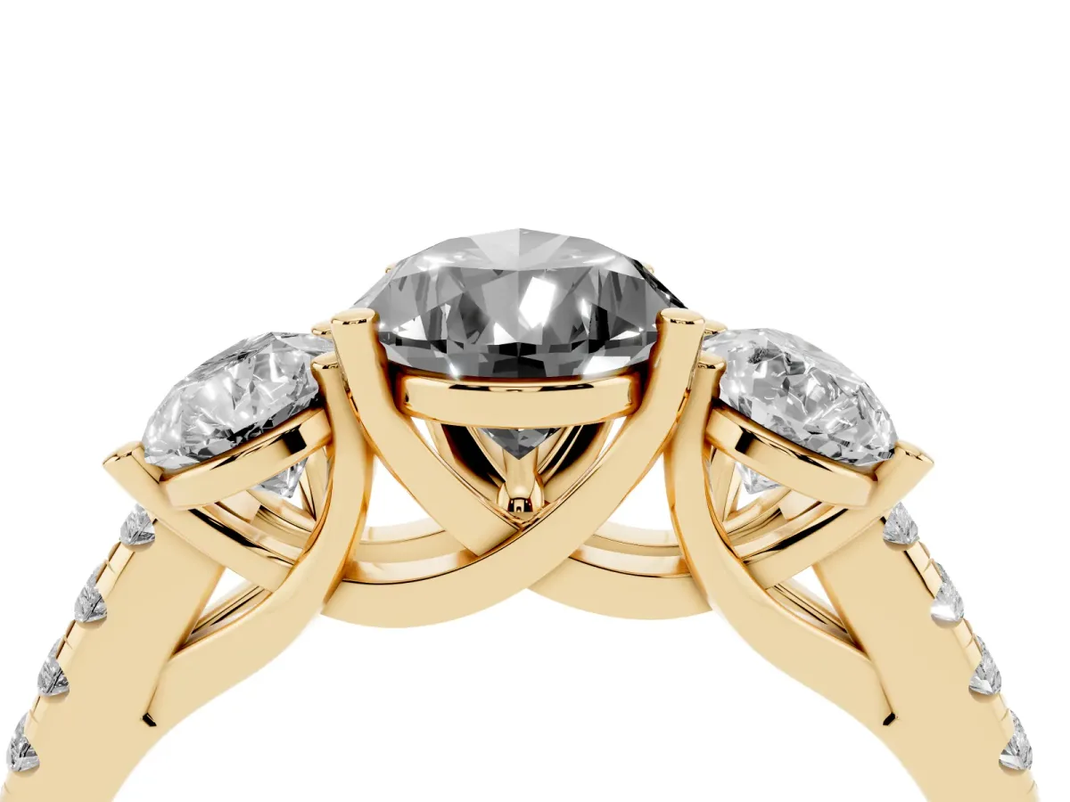 Fancy Black Three-Stone Pear Cut Diamond Ring with Round Pavé Band and Prong Setting Yellow gold