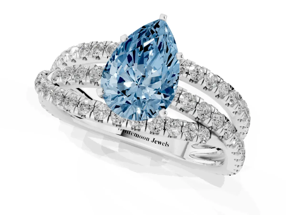 Fancy Blue Pear Cut Solitaire Twist Band with Pavé Setting and Four-Prong Setting Silver