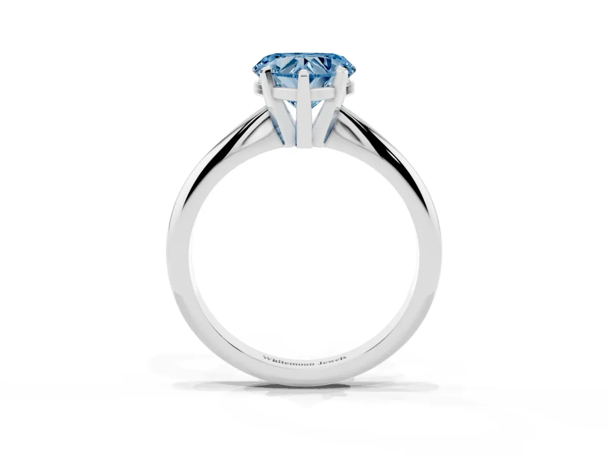 Fancy Blue Heart Cut Cut Solitaire Ring with Four-Prong Setting on a Classic Band Silver