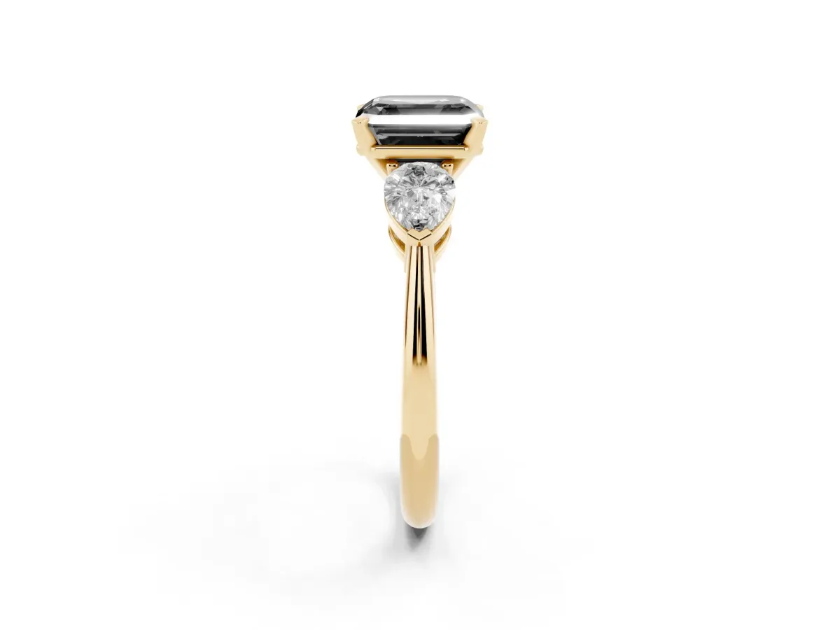 Fancy Black Three-Stone Asscher Cut Diamond Ring with Pear Side Stones and Four-Prong Setting Yellow gold