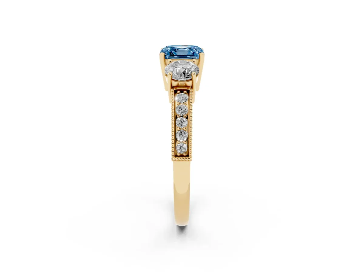 Fancy Blue Asscher Cut Three-Stone Diamond Ring with Pavé Band and Four-Prong Setting Yellow gold