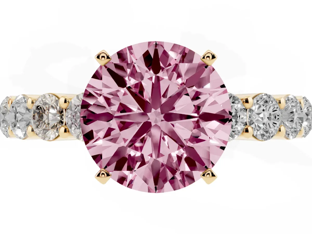 Fancy Pink Round Cut Diamond Solitaire Ring with Shared Prong Round Side Stones Yellow gold