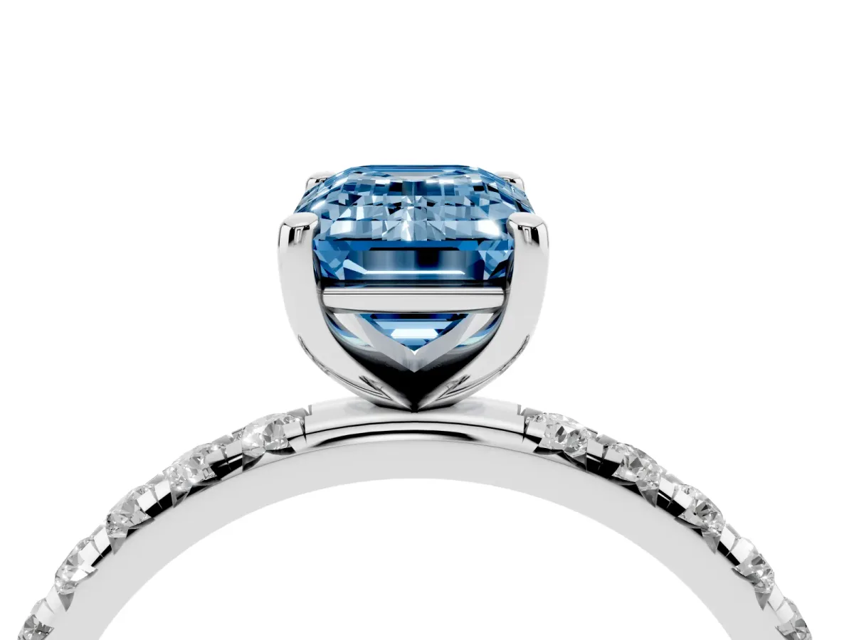 Fancy Blue Emerald Cut Cut Diamond Solitaire Ring with Micro Pave Band and Four Prong Setting Silver
