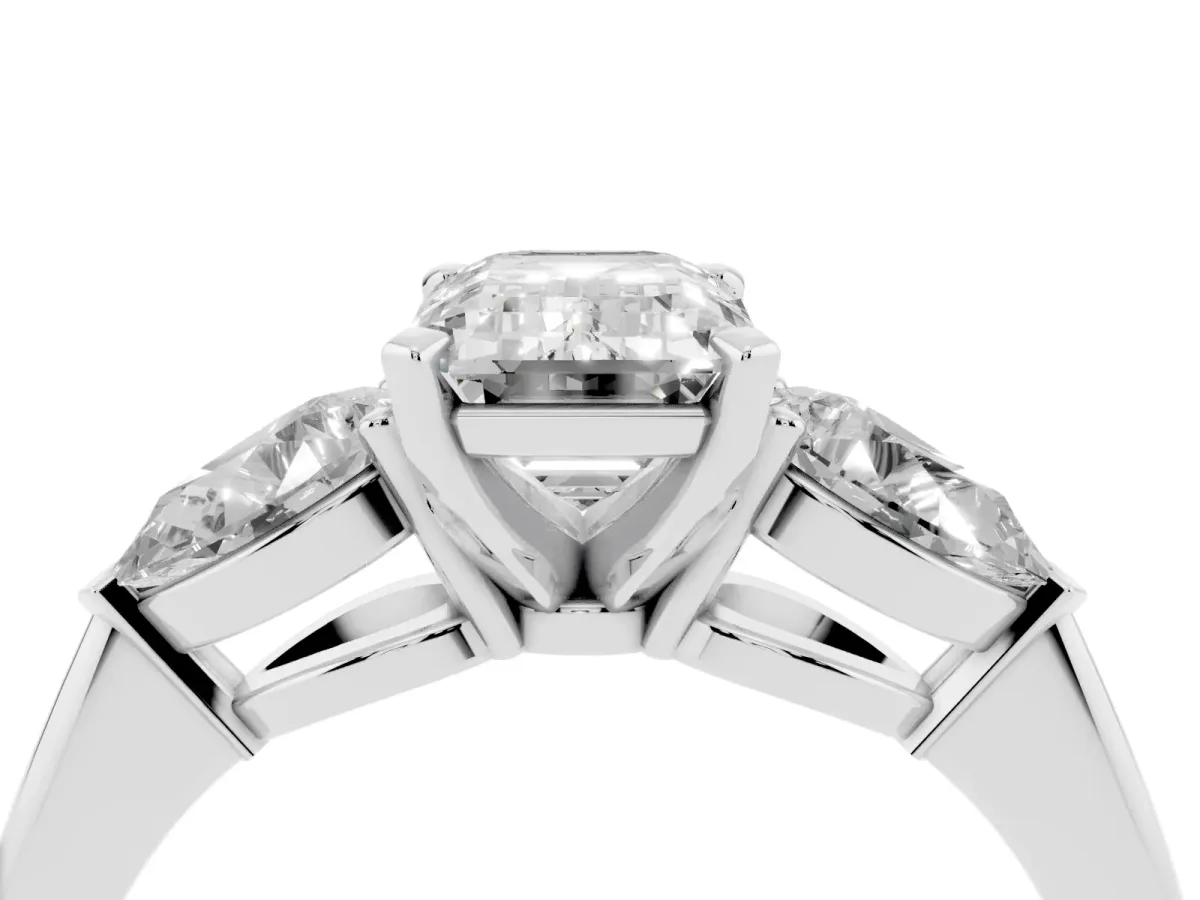 Three-Stone Emerald Cut Diamond Ring with Pear Side Stones and Four-Prong Setting Platinum