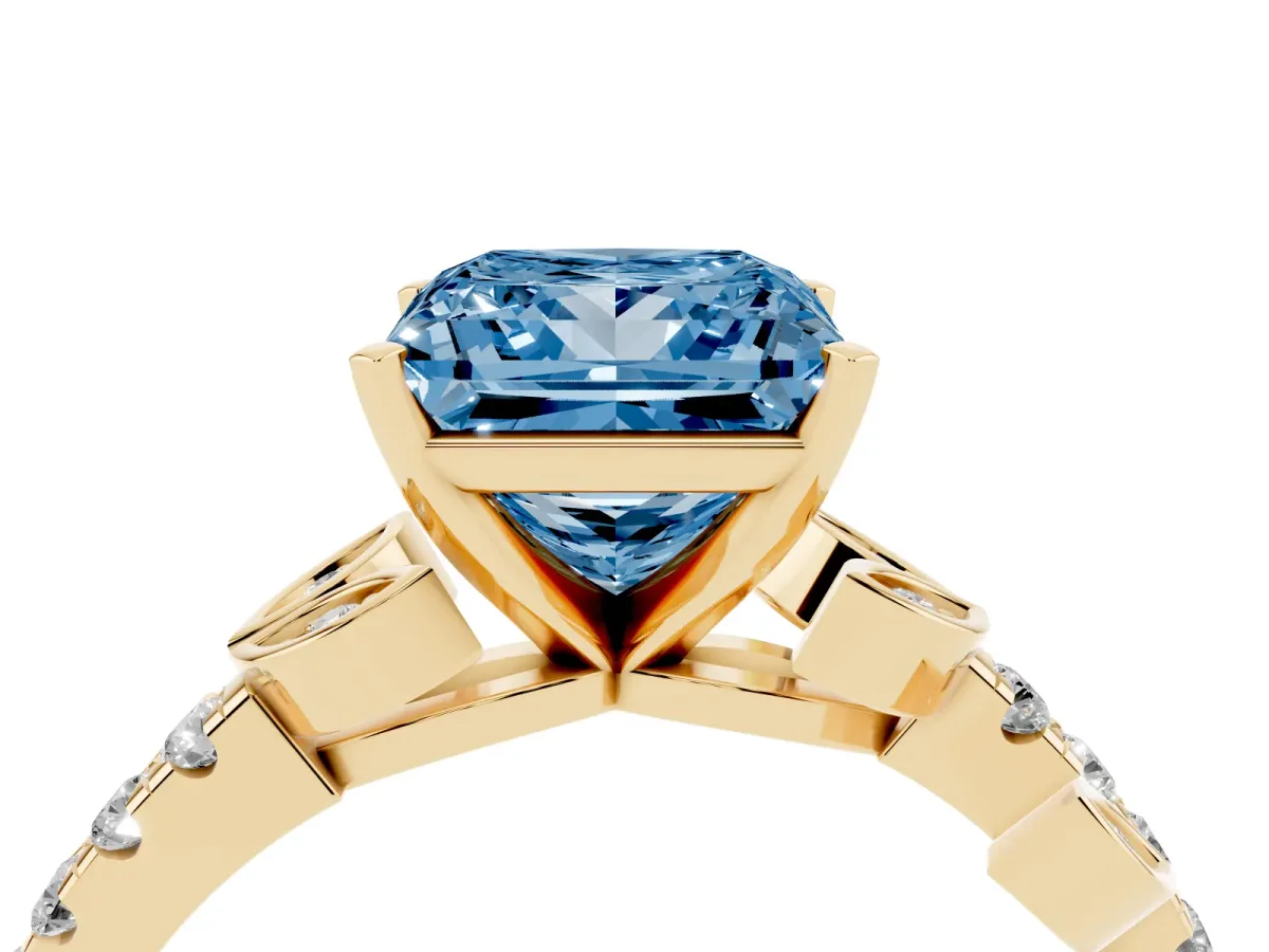 Fancy Blue Princess Cut Solitaire Leaf-Inspired Diamond Ring with Pavé Band and Four-Prong Setting Yellow gold